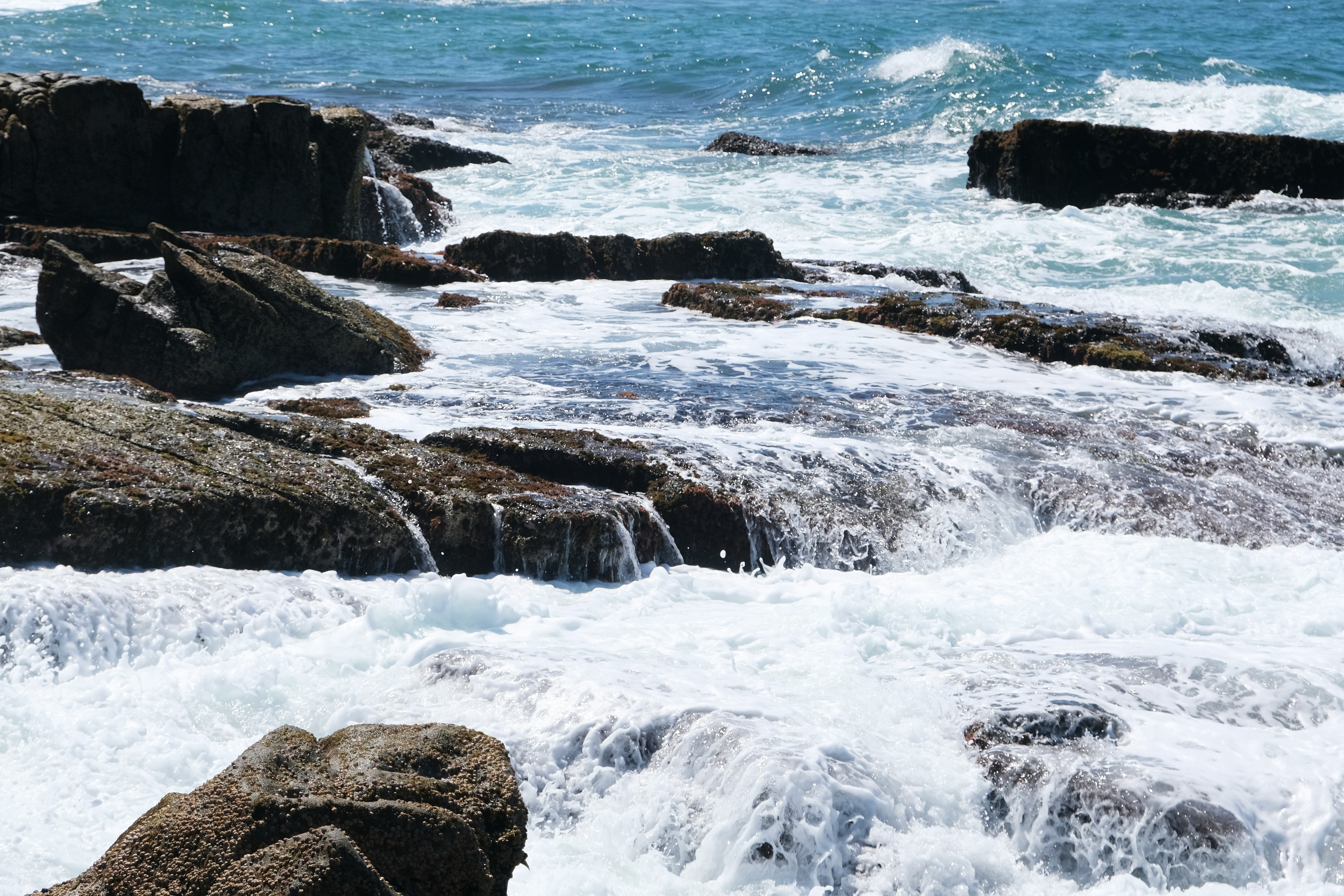 Waves crashing against rocks